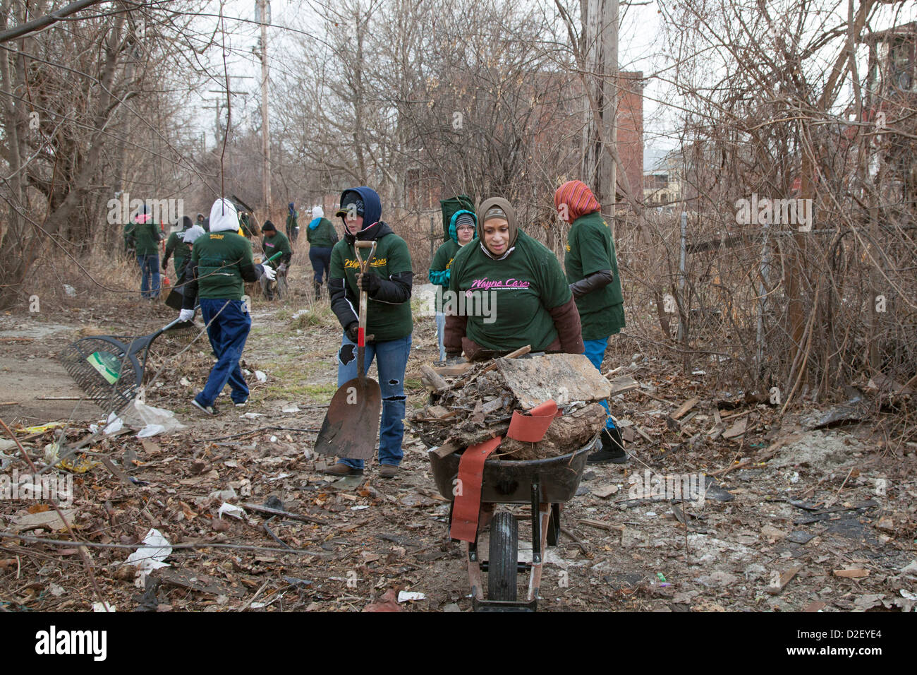 On Martin Luther King Day, college students and neighborhood residents volunteered to clean trash from vacant properties. Stock Photo