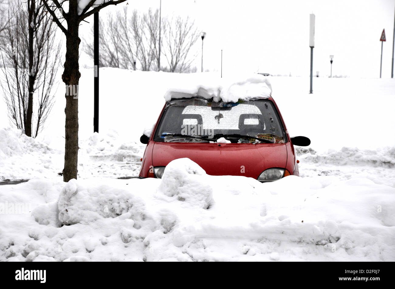 small red car under snow Stock Photo
