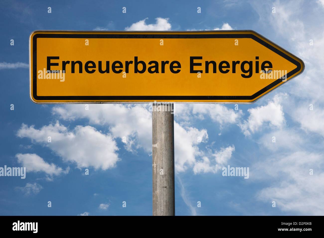 Wegweiser mit der Aufschrift Erneuerbare Energie | Detail photo of a signpost with the German inscription renewable energy Stock Photo