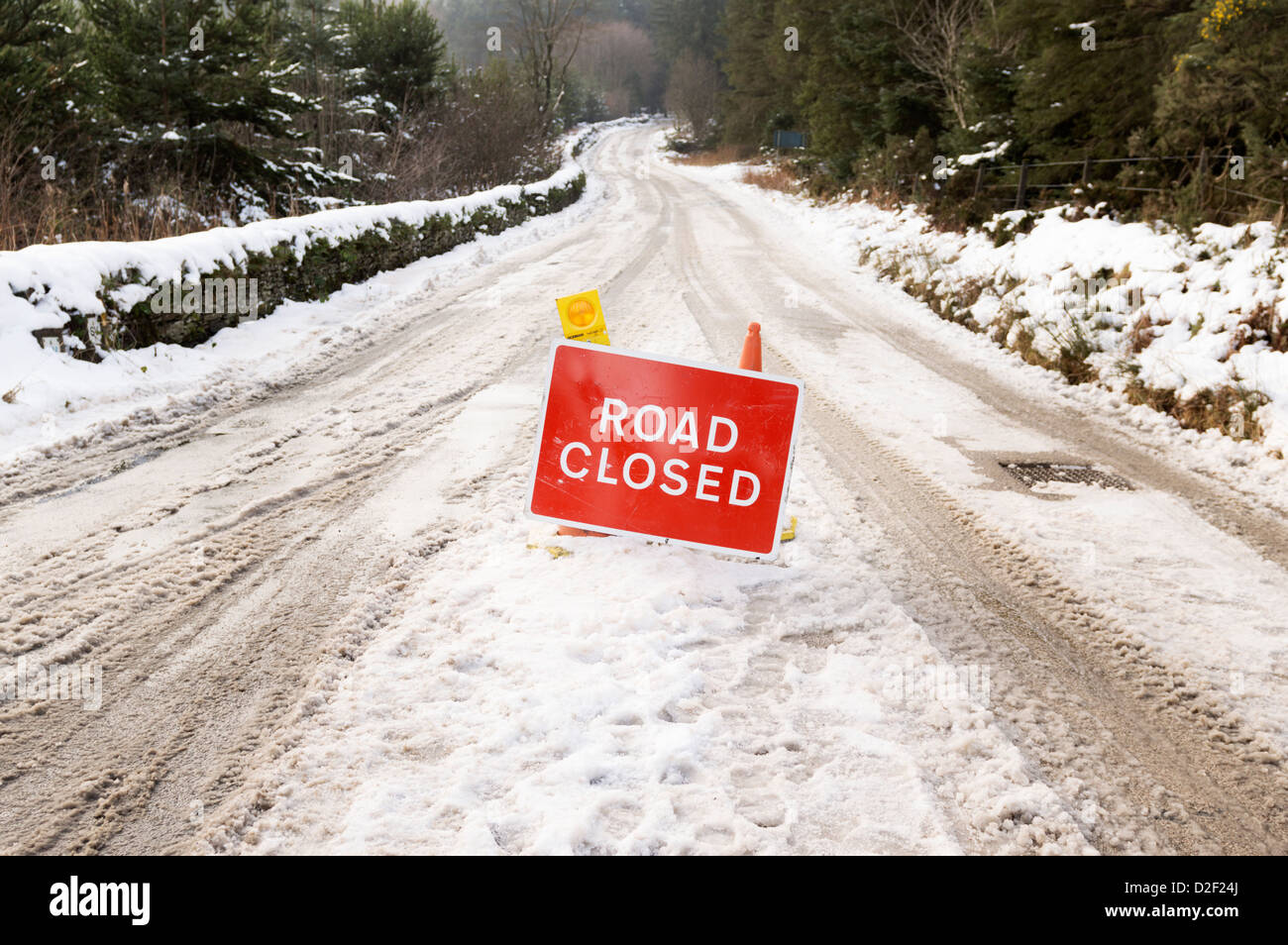 Road closed sign country roads closed because of snow Stock Photo Alamy