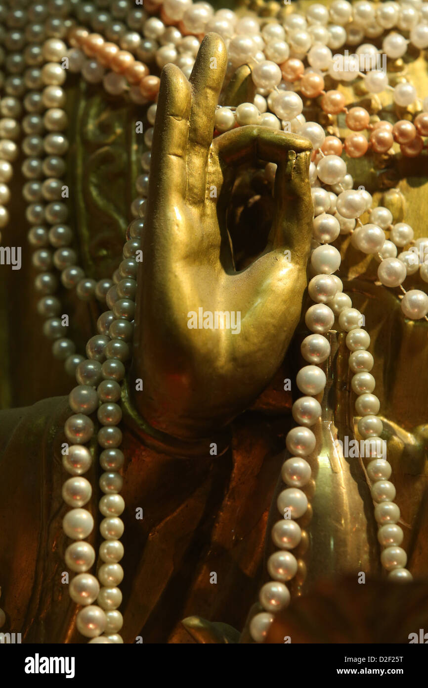 Goddess of compassion Guanyin in a Chinese Buddhist temple. Paris. France. Stock Photo