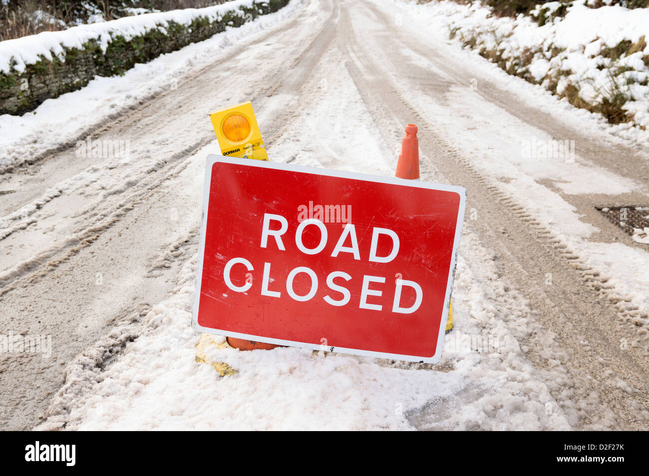 Road closed sign - country roads closed because of snow Stock Photo