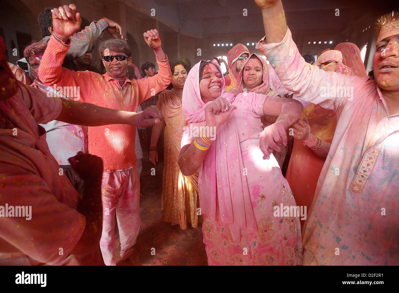 Dancers celebrating Holi festival in Barsana temple India Stock Photo