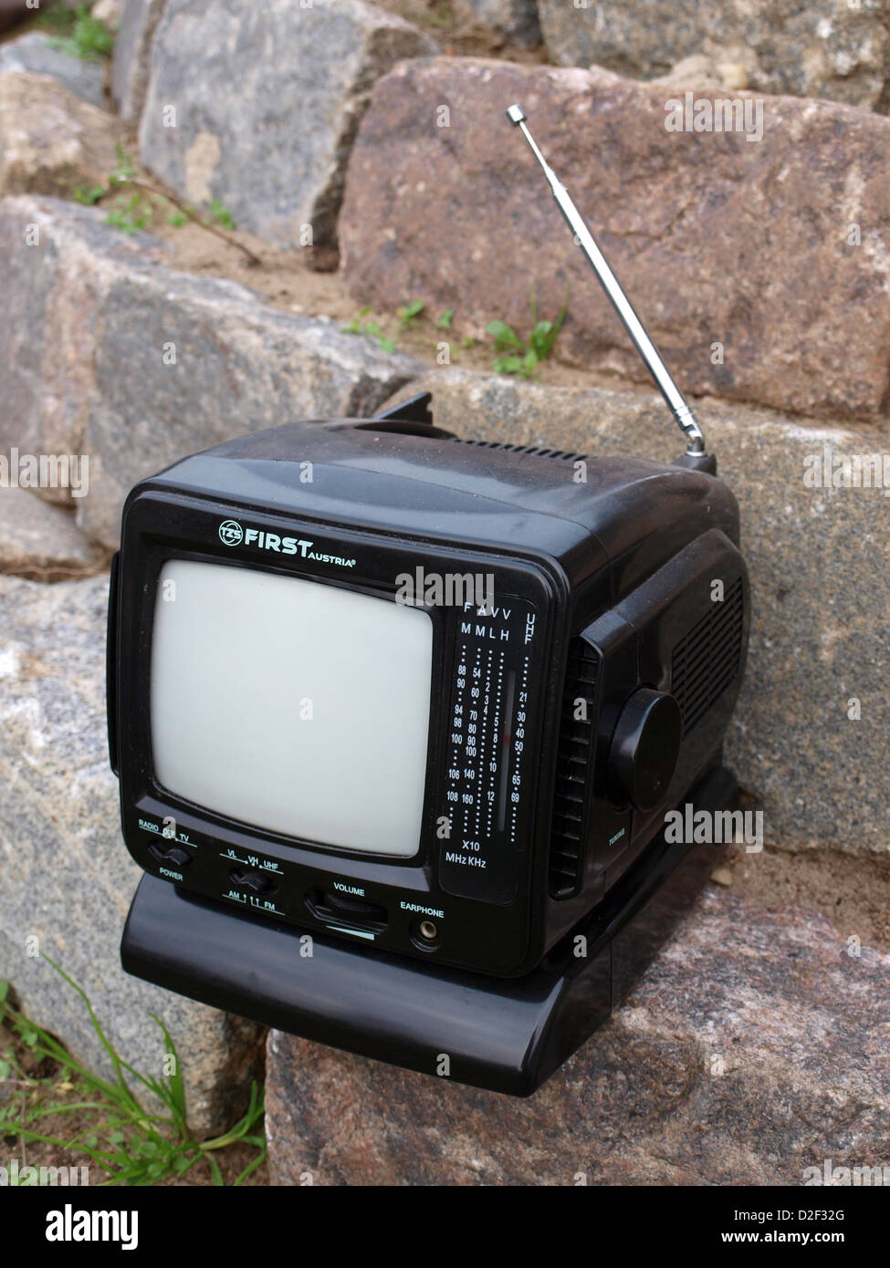 Old retro portable small radio television set FIRST, outdoor, close up Stock Photo