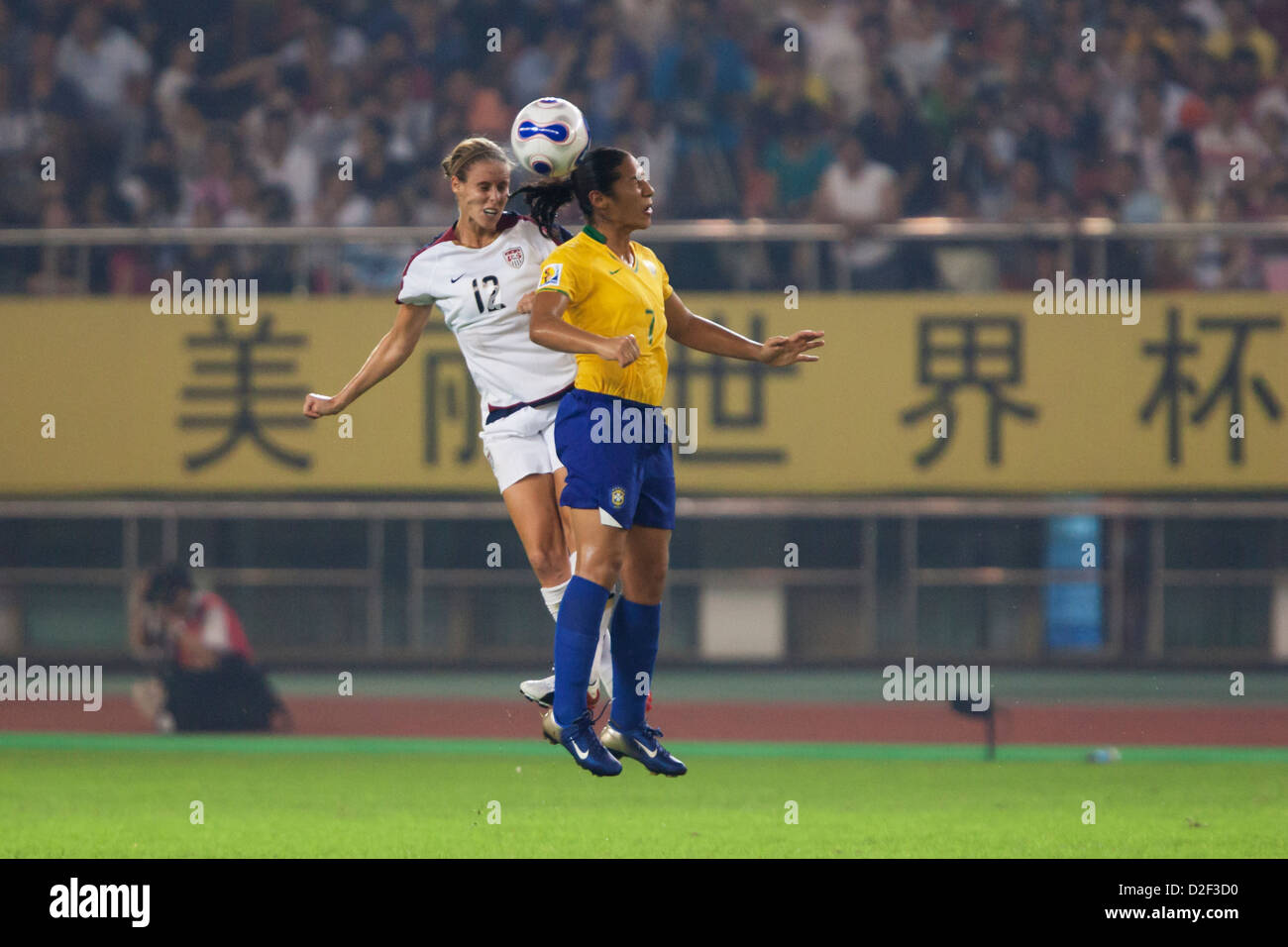 Leslie Osborne of the United States (L) and Daniela of Brazil (R) clash for a header during a FIFA Women's World Cup semifinal. Stock Photo