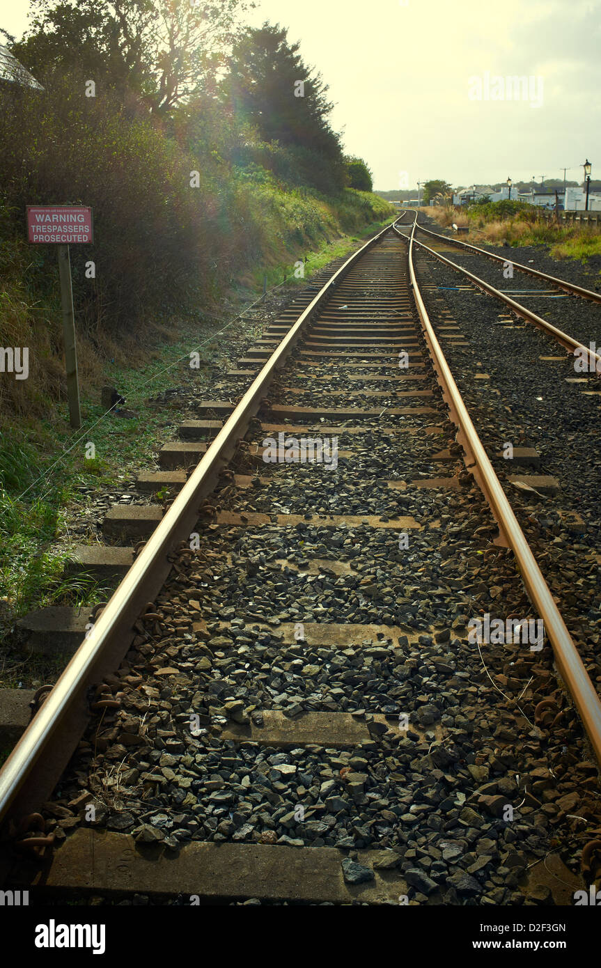Railway track with warning trespassers prosecuted sign Stock Photo