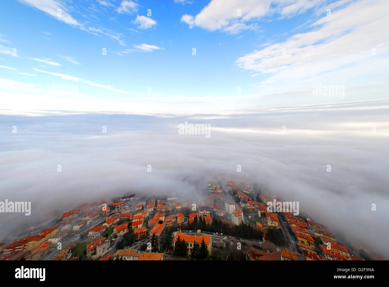 Serenissima Repubblica di San Marino. January 21, 2013 , The territory of San Marino Republic was covered up with a thick coat of clouds. Only the towers on Mount Titano pierced  the clouds. Credit: Ferdinando Piezzi Stock Photo