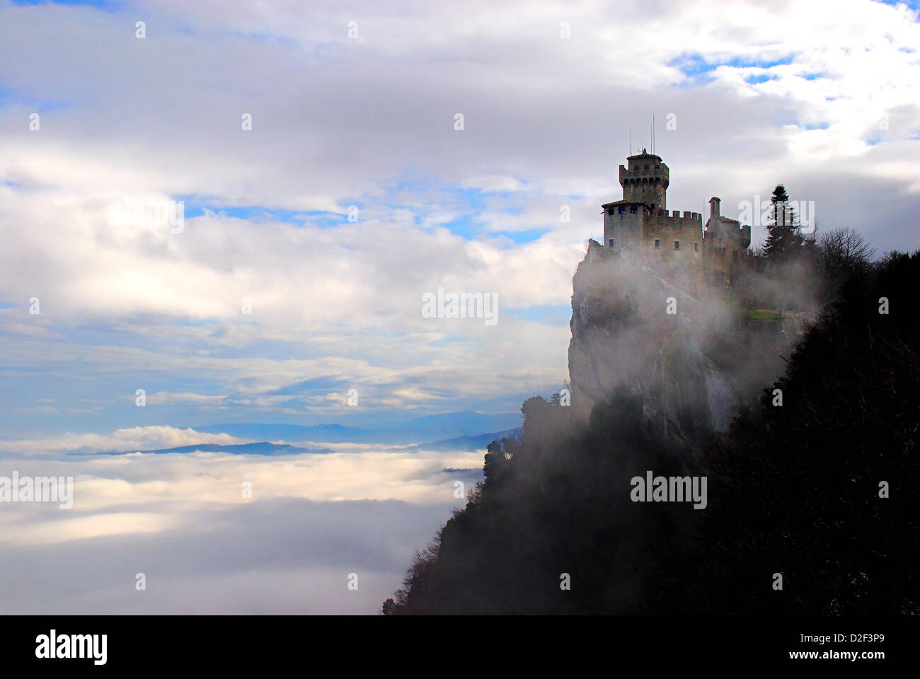 Serenissima Repubblica di San Marino. January 21, 2013 , The territory of San Marino Republic was covered up with a thick coat of clouds. Only the towers on Mount Titano pierced  the clouds. Credit: Ferdinando Piezzi Stock Photo