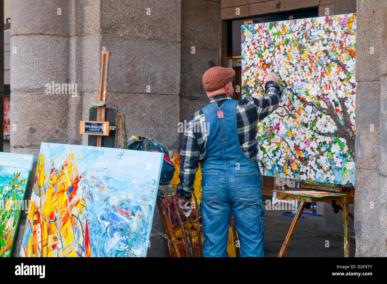 Painter painting a picture at Main Square. Madrid, Spain. Stock Photo