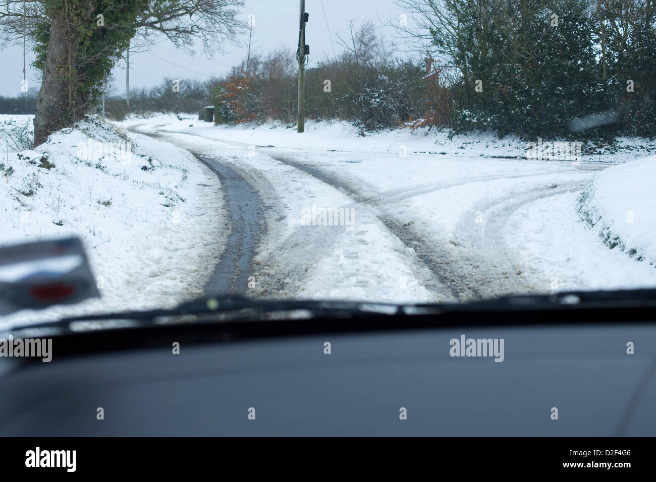 The view from inside a car of snow covered rural roads in Norfolk,UK ...