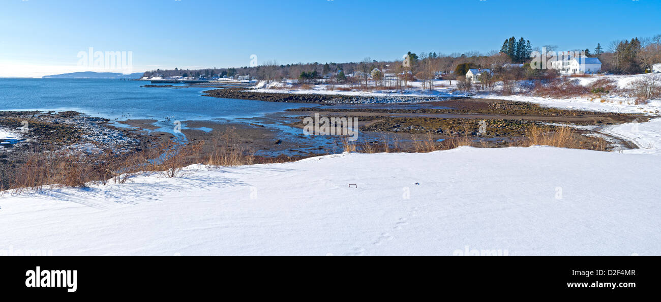 The coastal shoreline at low tide in the wintertime of Searsport Maine