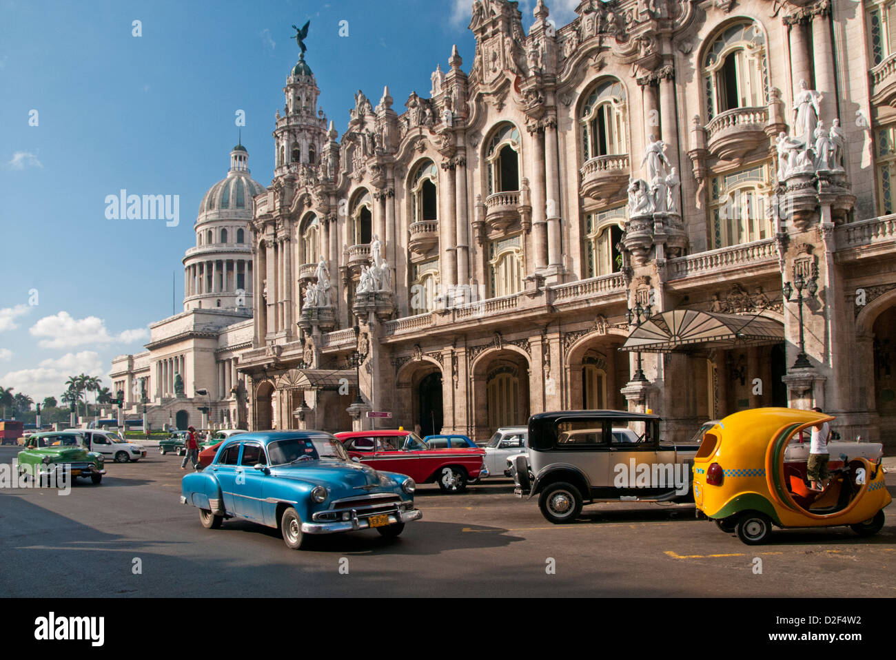 Classic 1950's American Cars Passing The Capitolio Building & Gran Teatro de la Habana, Paseo de Marti, Havana, Cuba Stock Photo