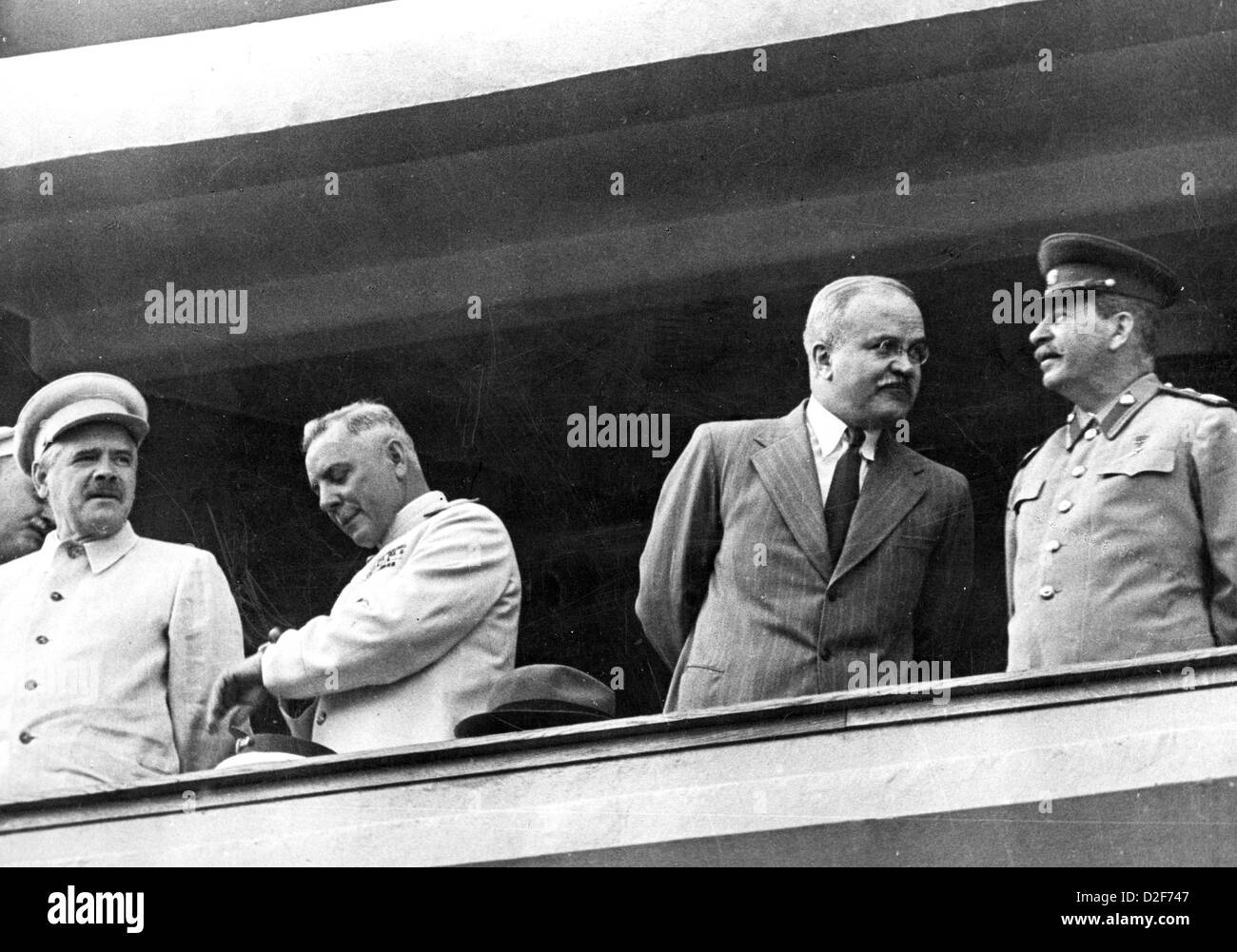 VYACHESLAV MOLOTOV talks to Joseph Stalin while watching a Physical Culture Day Parade at the Moscow Dynamo Stadium in 1943 Stock Photo