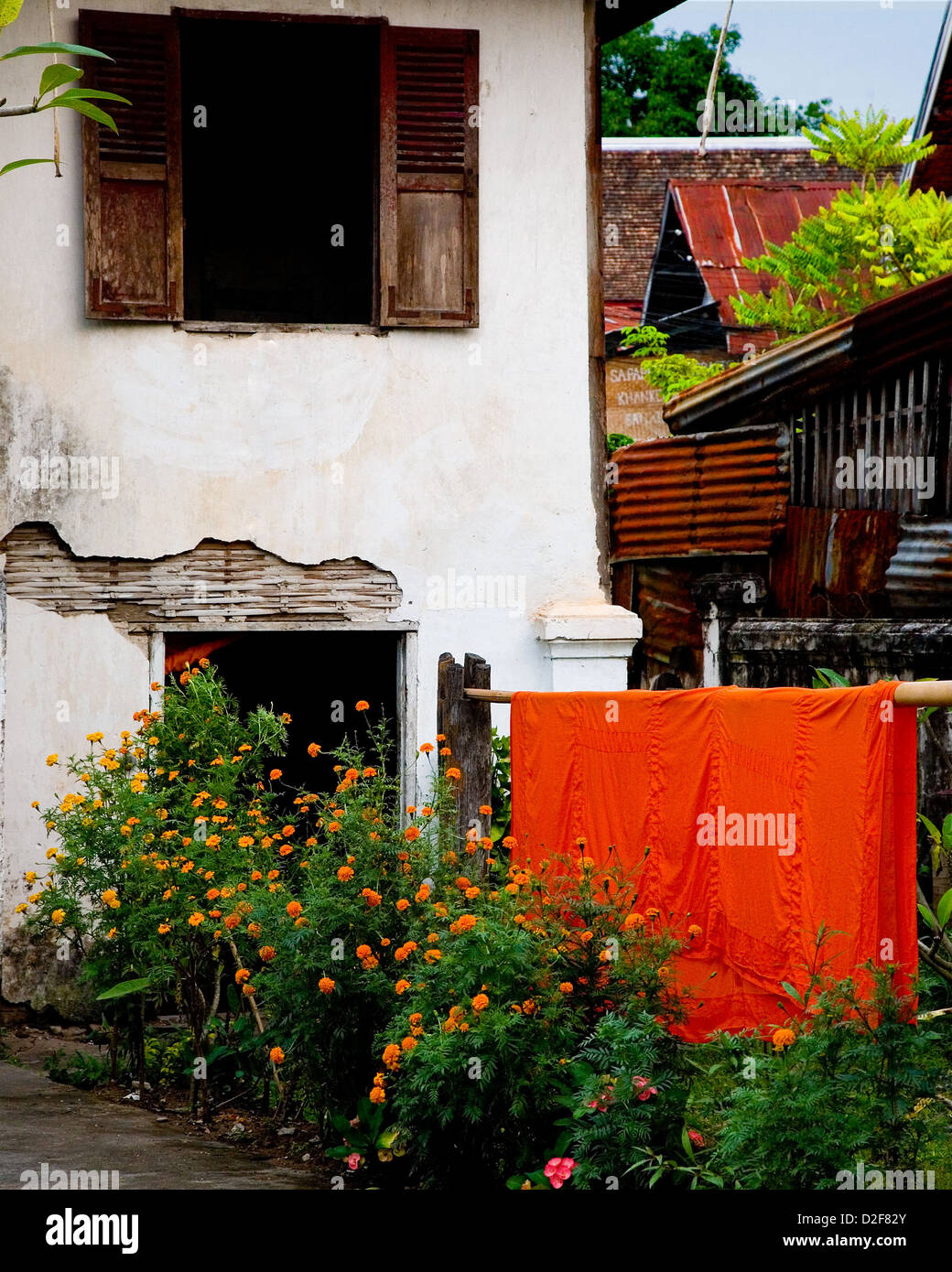 Monks' robes drying in the yard of a monastery in Luang Prabang, Laos Stock Photo