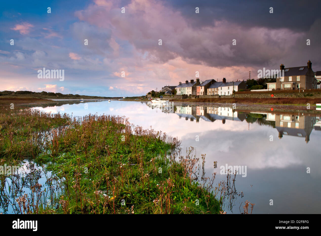 Storm Clouds Gather over Afon Ffraw & Riverside Cottages, Aberffraw, Anglesey, North Wales, UK Stock Photo