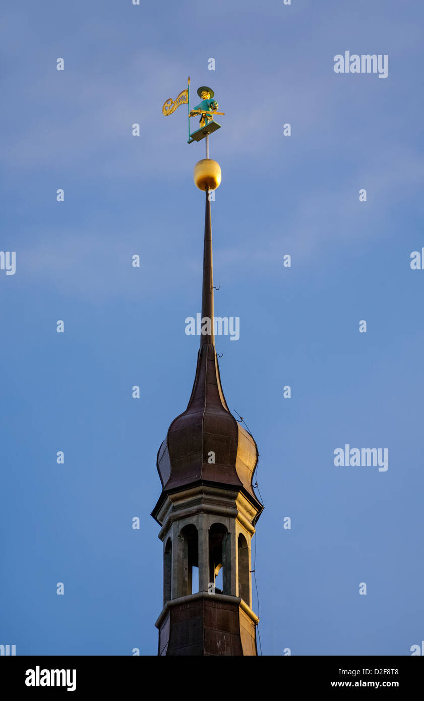 Tallinn Town Hall, historical vane Vana Toomas ( Old Toomas ) on the top of baroque spire of medieval building. Stock Photo