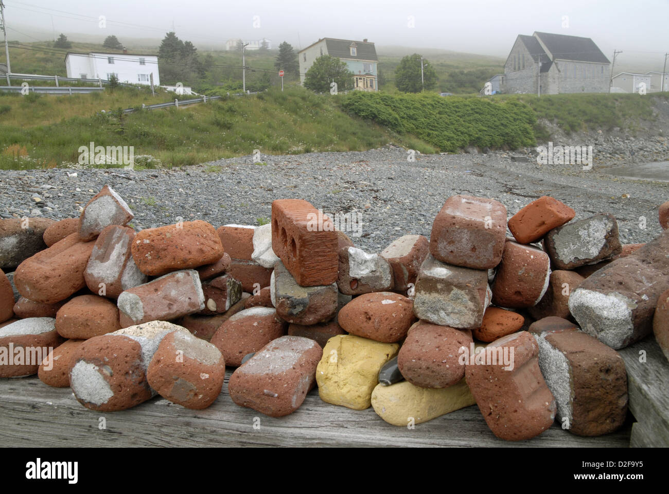 Collection of weathered bricks on a beach in Newfoundland Stock Photo