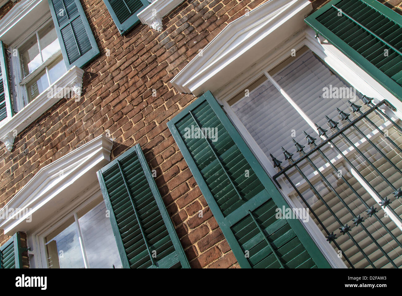 Georgian Style House Facade with green window shutters Stock Photo