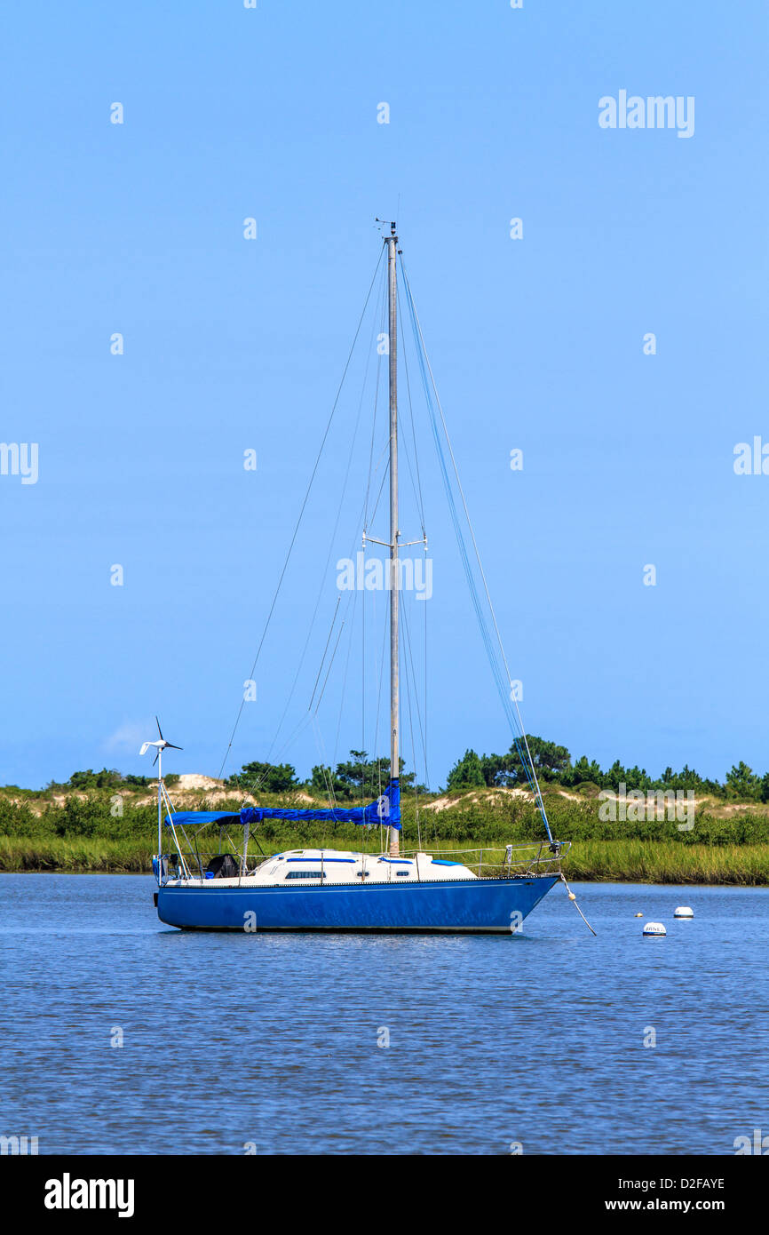 Sailing boat anchoring near beach coastline Stock Photo