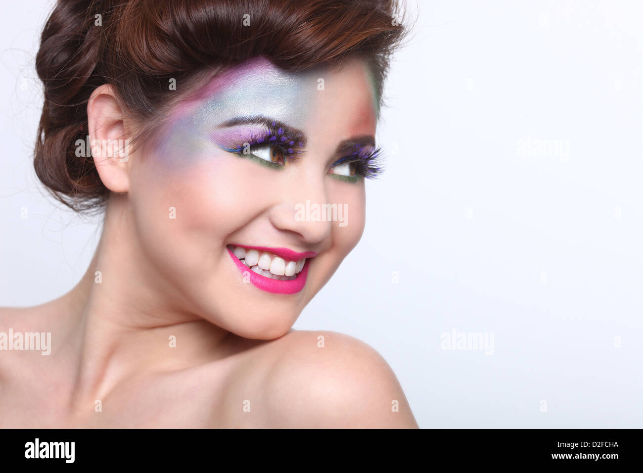 Woman With Colorful Creative Cosmetics on White Stock Photo