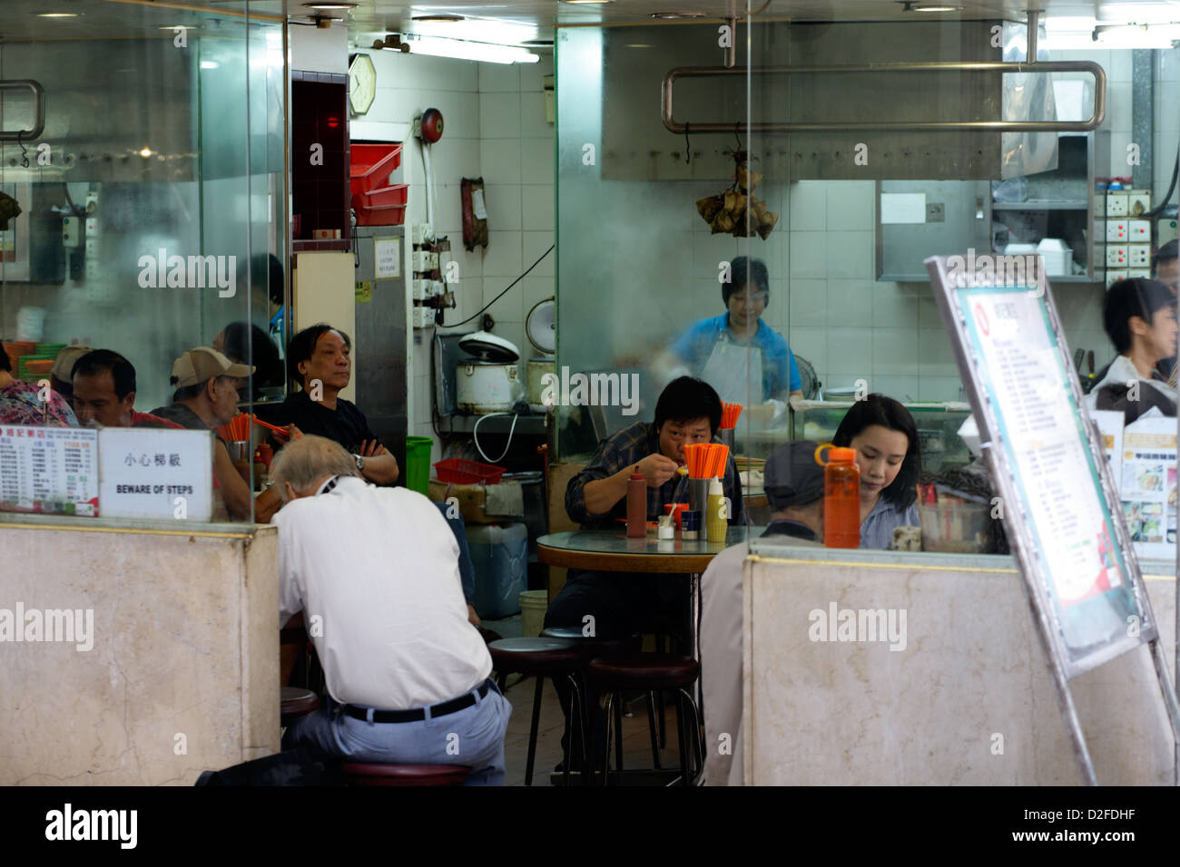 Hong Kong, China, guests sit in a kitchen in Hong Kong Central Stock Photo