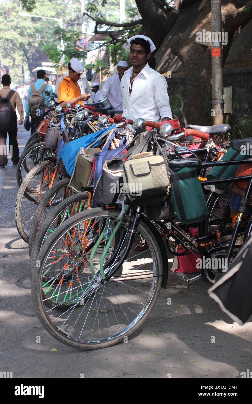 Dabbawalas pack food together for delivery at Andheri Station in Mumbai, India, 20 November 2012. 5,000 food delivers take 175,000 lunches to workplaces every day in Mumbai. Photo: Doreen Fiedler Stock Photo