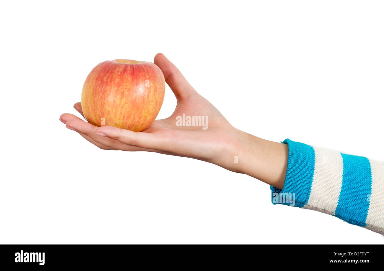 Woman's hand holding an apple Stock Photo