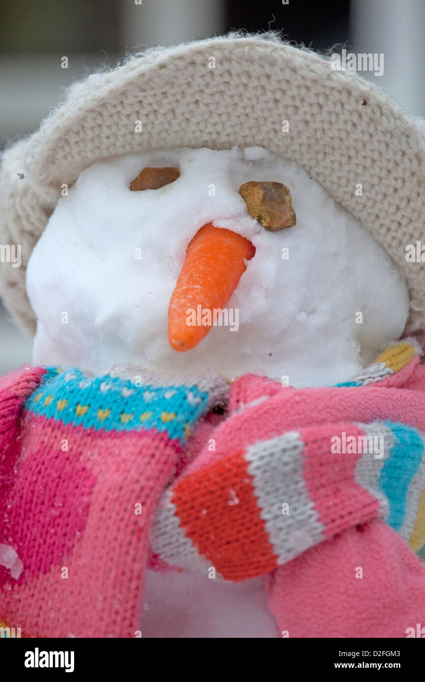 close up of snowman head with hat and scarf Stock Photo