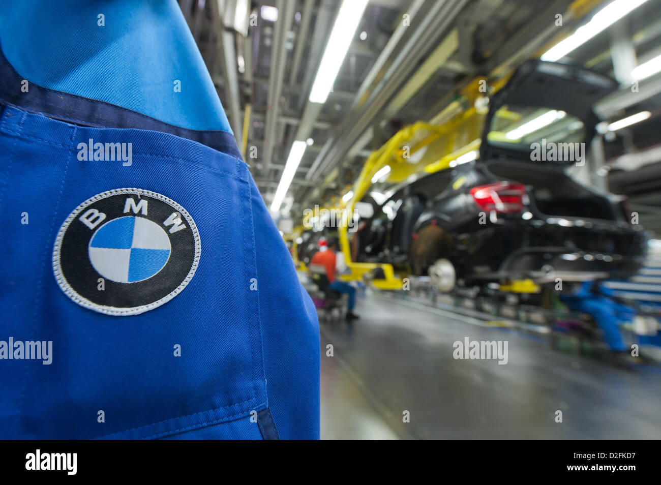 A BMW logo is sewed on a jacket, 7 March 2012, at the BMW factory in Regensburg. In 2011, BMW made a sales record. It was be best year in the history of the company. Stock Photo