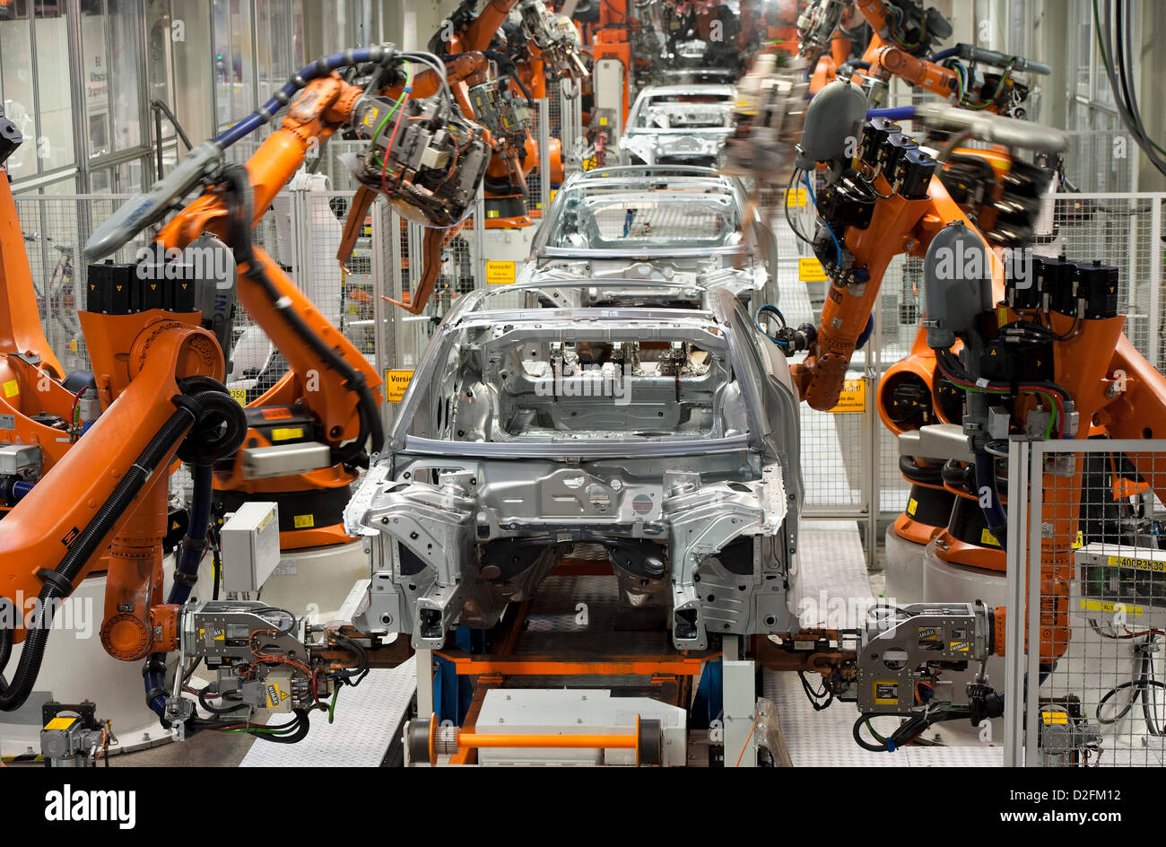Robots are working on a body framework on Wednesday, 29 February 2012, at the Audi factory in Ingolstadt. Stock Photo