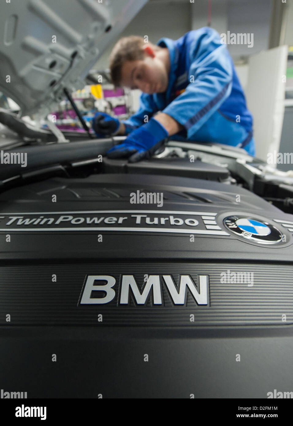 An employee is working on the engine of the new BMW 3 series on Wednesday, 7 March 2012, at the BMW factory in Regensburg. In 2011, BMW made a sales record. It was be best year in the history of the company. Stock Photo