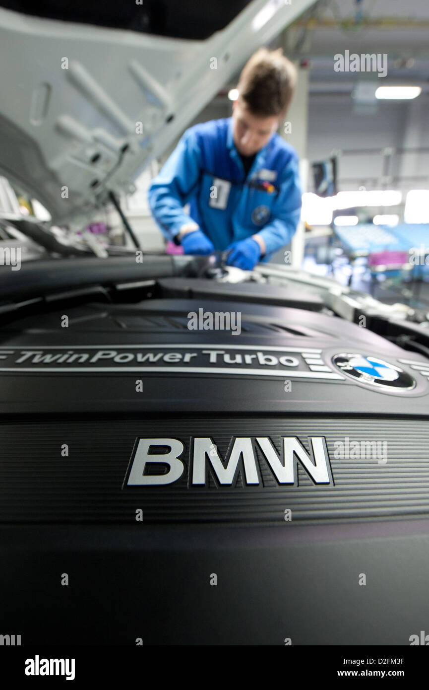 An employee is working on the engine of a BMW on Wednesday, 7 March 2012, at the BMW factory in Regensburg. Due to a sales record in 2011, the profit of the Bavarian automobile producer also rised in unknown hights. Stock Photo
