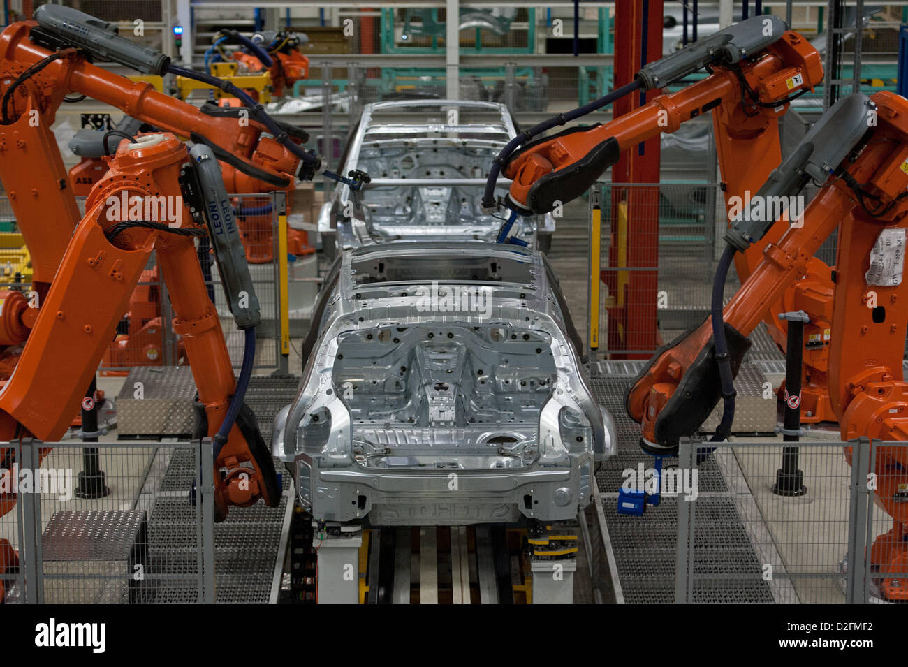 Robots are working on the bodies on Wednesday, 7 March 2012, at the BMW factory in Regensburg. Due to a sales record in 2011, the profit of the Bavarian automobile producer also rised in unknown hights. Stock Photo