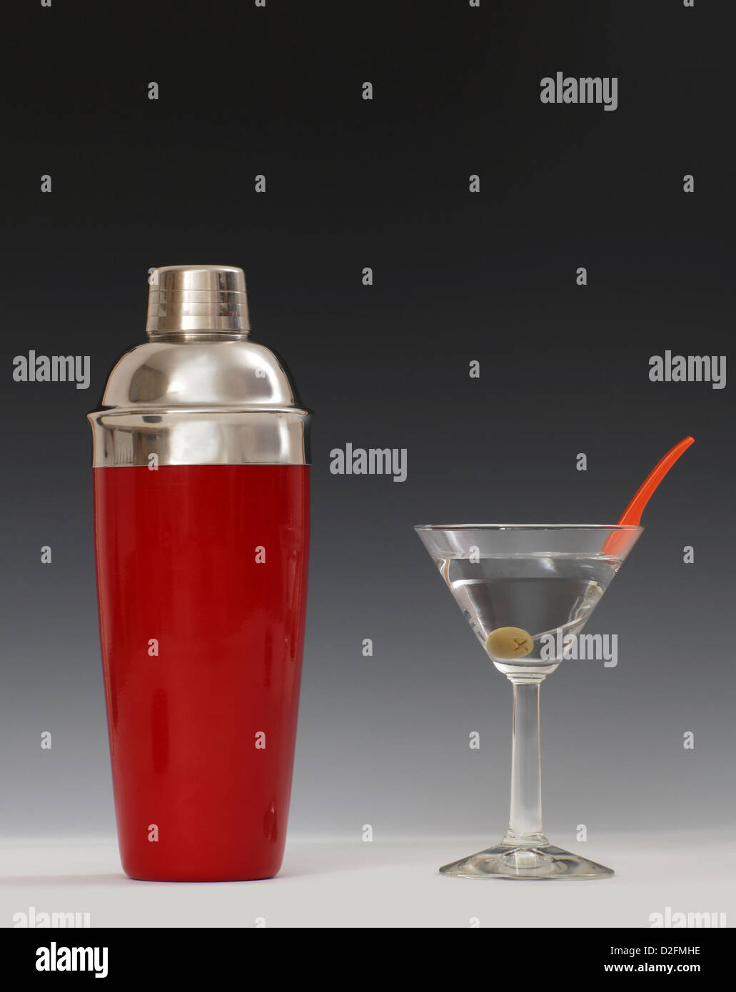 Cocktail shaker beside a Martini glass Stock Photo