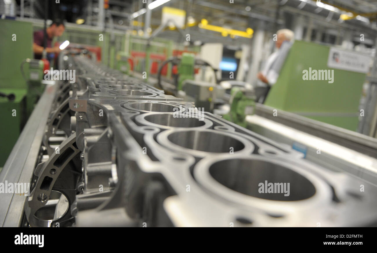 A Daimler employee is working on engines, on 20 September 2012, at the Mercedes-Benz plant Untertürkheim in Stuttgart, Baden-Wurttemberg. Stock Photo