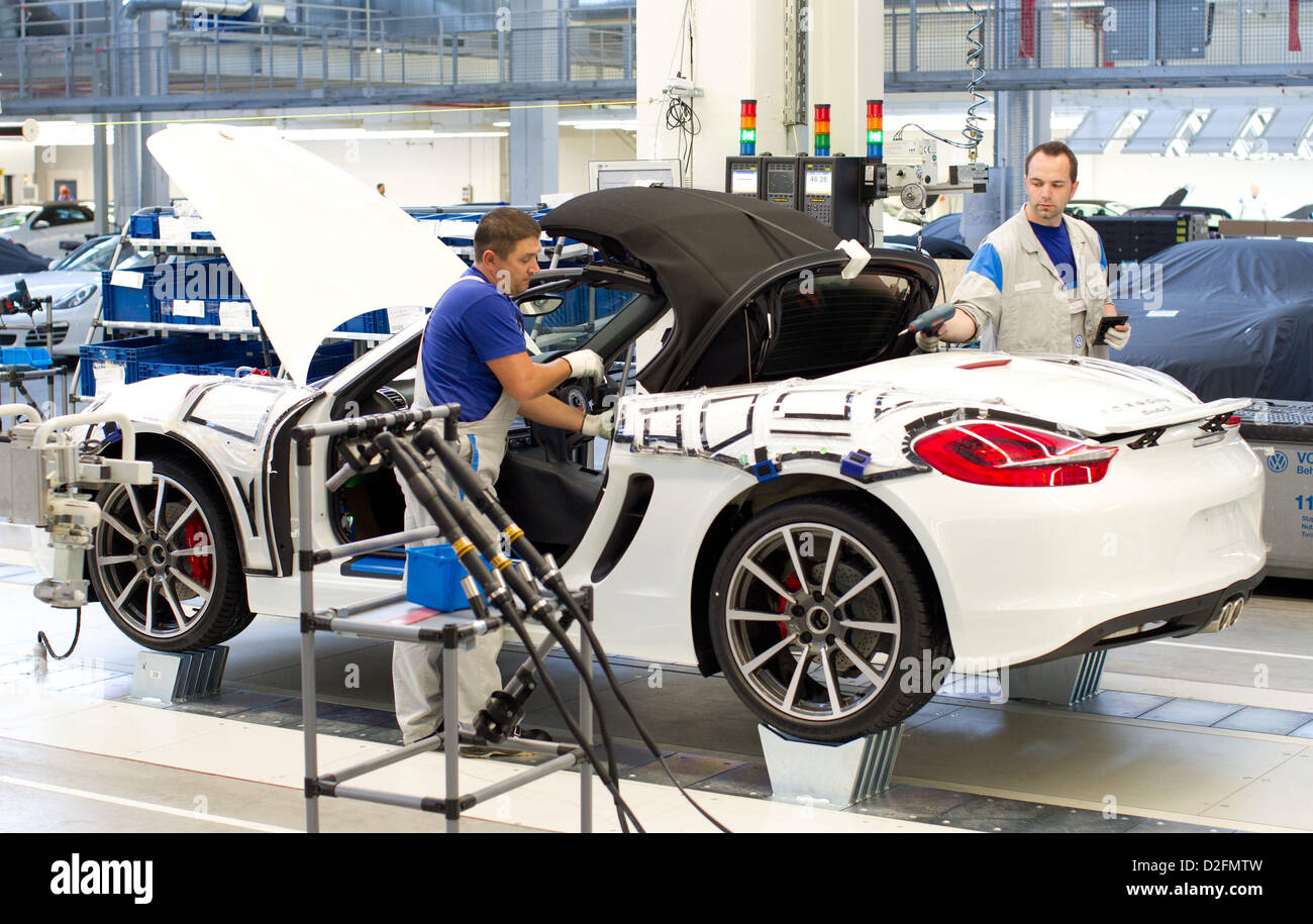 Employees are working on a Porsche Boxster on 4 September 2012 at the Volkswagen plant in Osnabrück. The Boxster models are now also produced at the Volkswagen plant in Osnabrück due to the high demand. Stock Photo