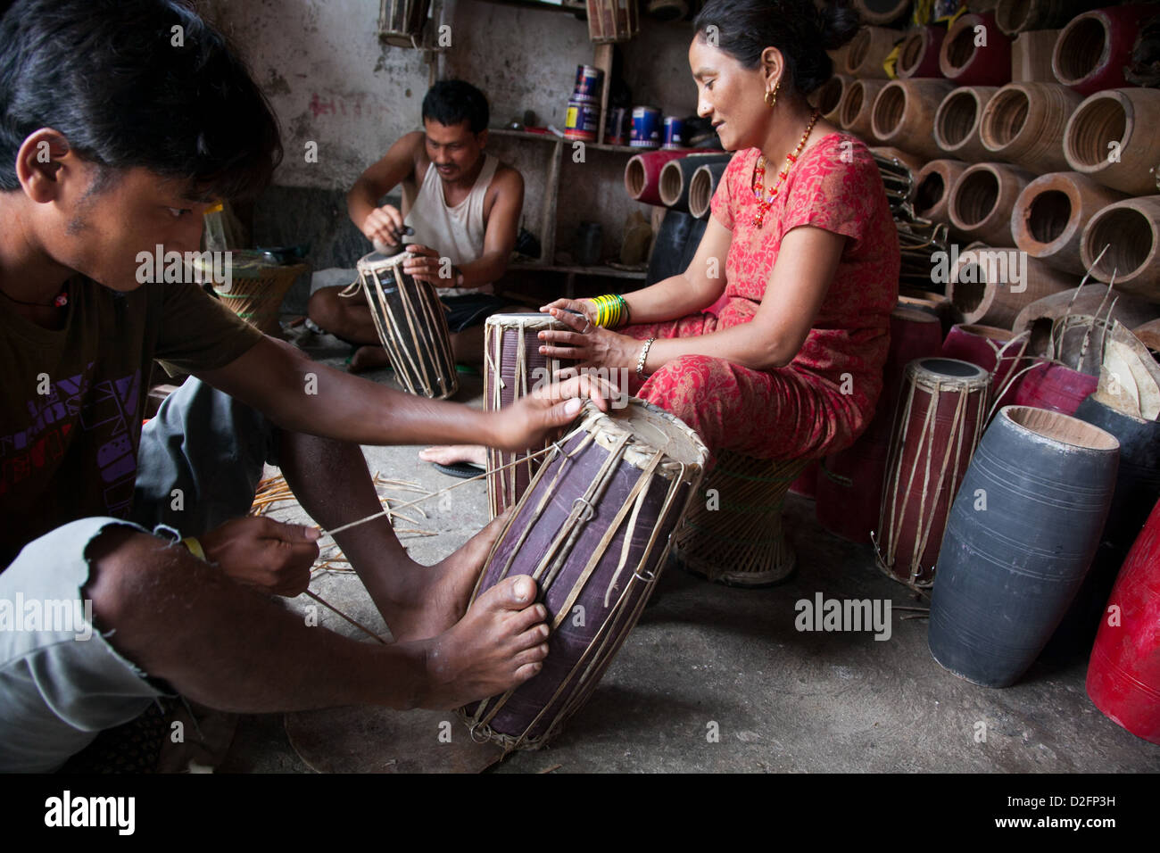 Traditional drums made by hand and feet. The strings made by goats intestines are tightened to make the drum skin tight. Stock Photo