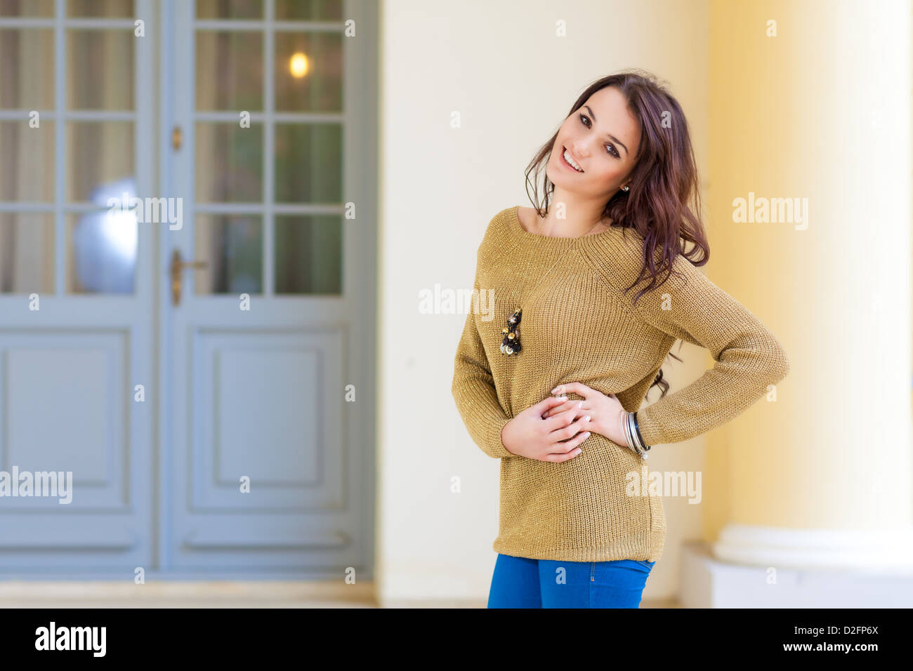 Cute woman in sweater posing Stock Photo