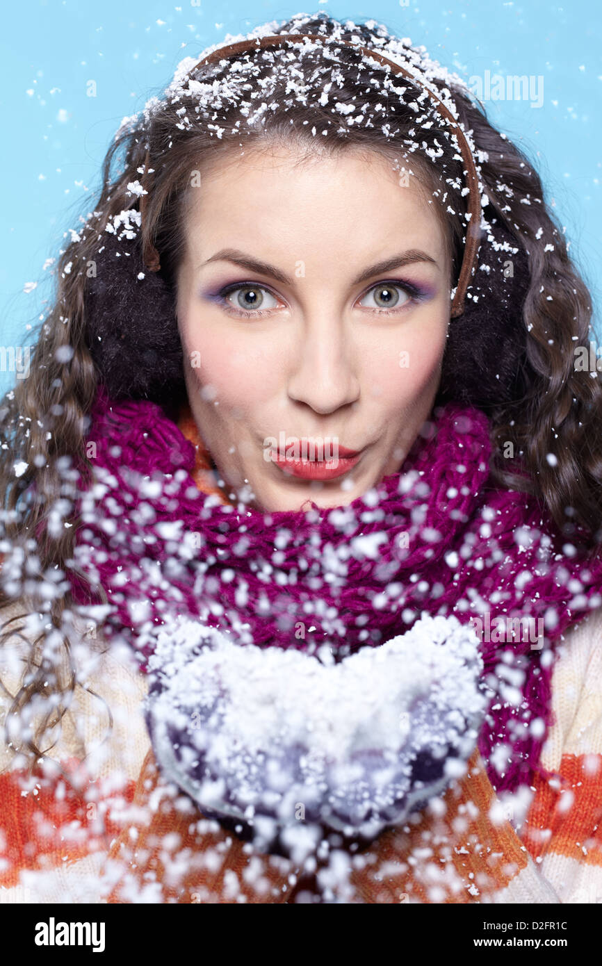 Winter portrait of young woman with snow Stock Photo - Alamy