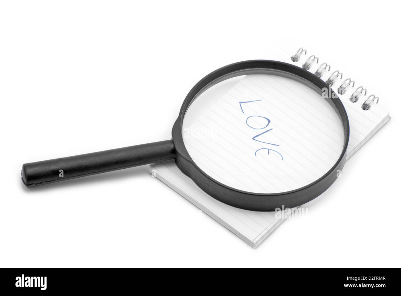 Notebook and magnifier Stock Photo