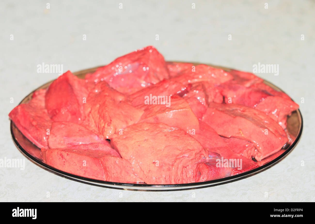 meat on a dark plate Stock Photo