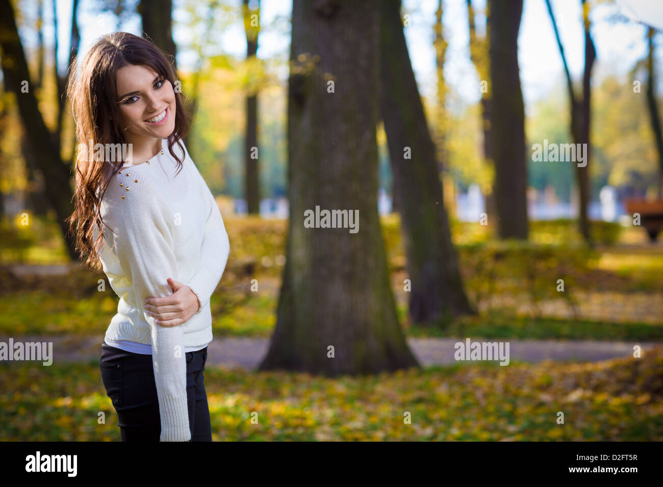 Cute woman posing in park Stock Photo