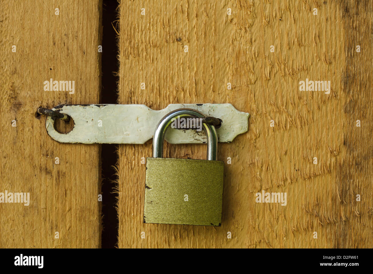 Metal lock on the wooden door closeup Stock Photo - Alamy