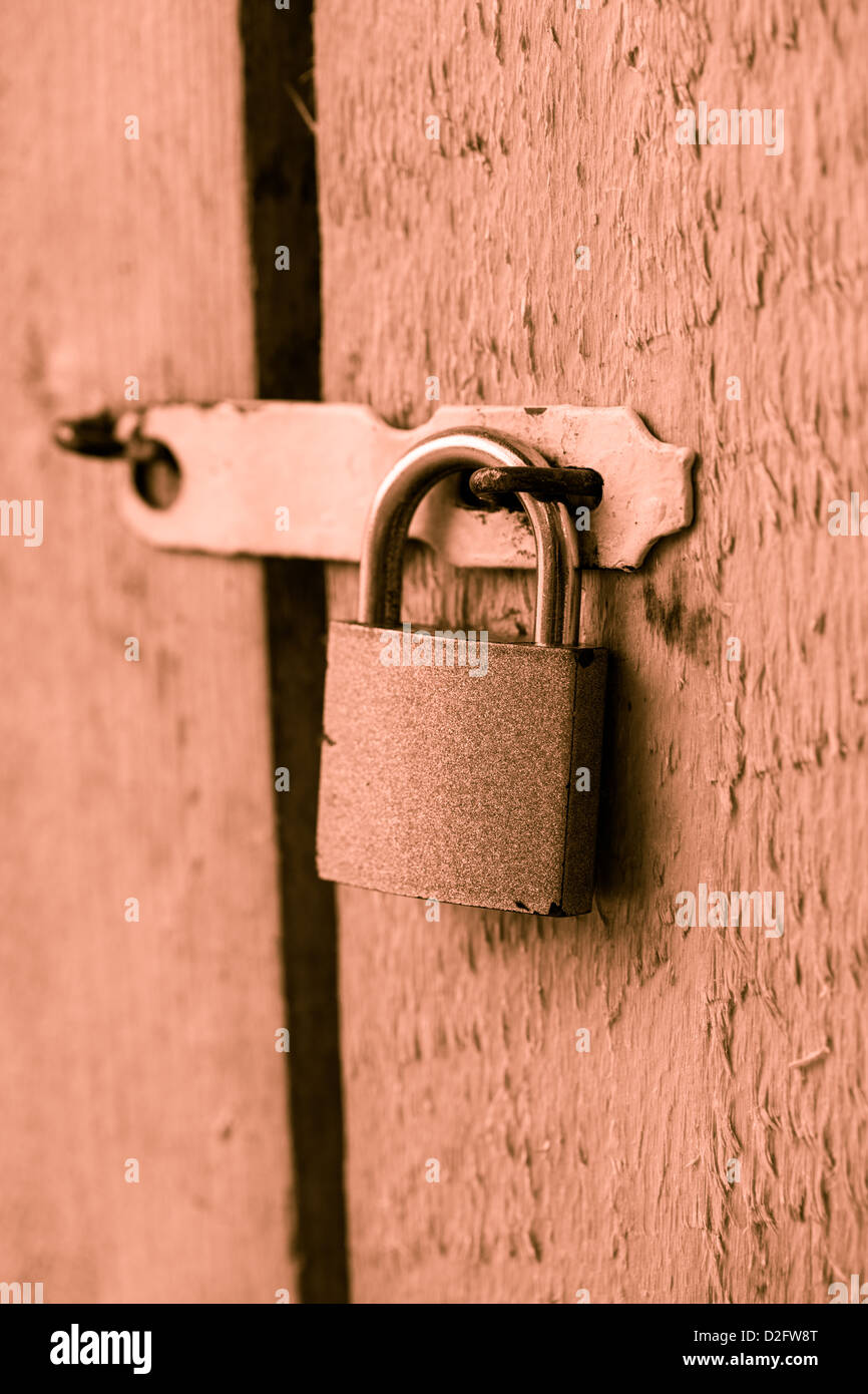 Metal lock on the wooden door closeup Stock Photo - Alamy