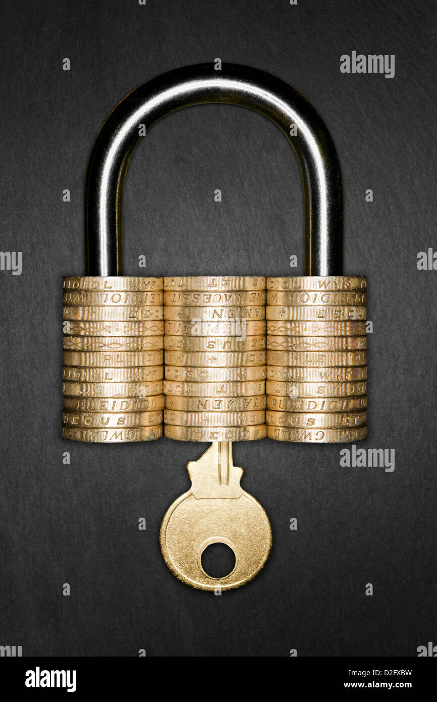 Padlock made from pound coins with a gold key inserted - Security / Saving money / savings / pension pot / wealth UK concept Stock Photo