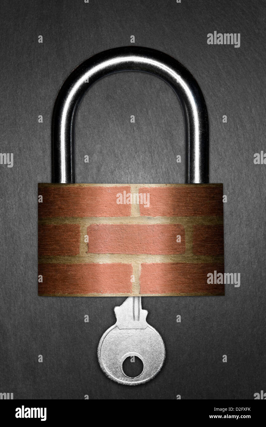 Padlock made from brick and silver key - home security housing concept Stock Photo