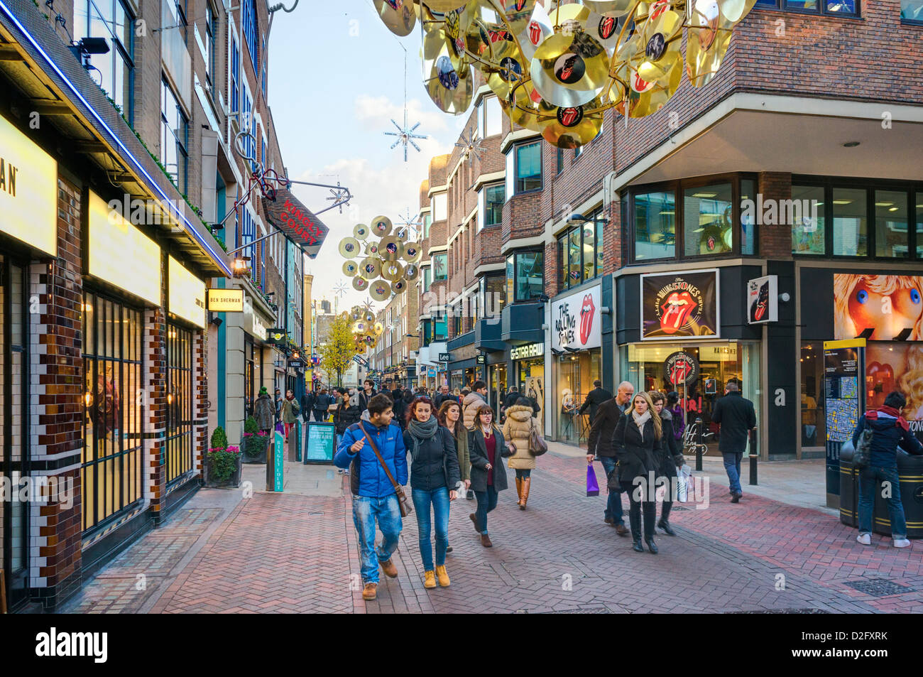 Famous London street, Carnaby street in winter / Christmas, London, UK - with the Rolling Stones shop in background Stock Photo