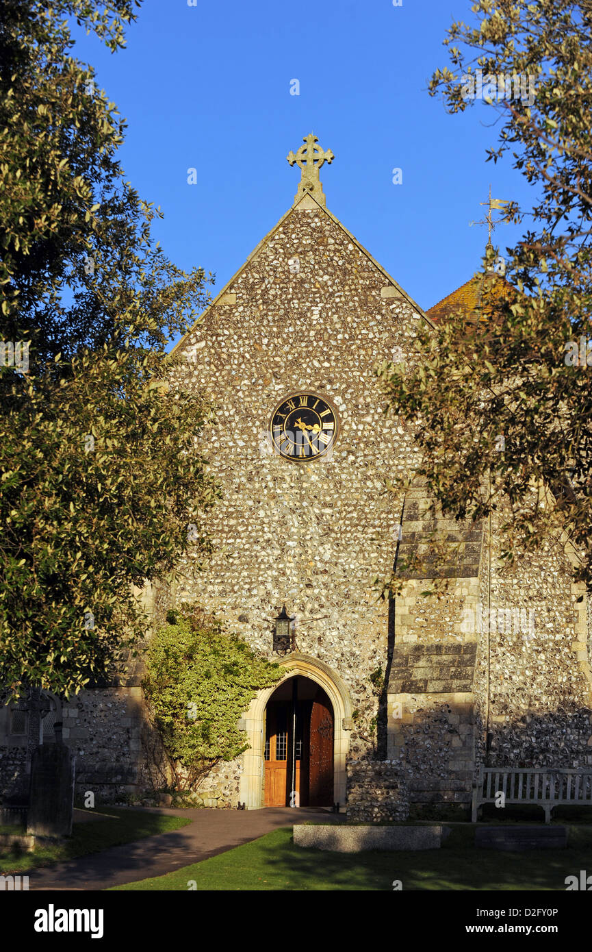 Sun shines on the front of St Margaret's Church in the village of Rottingdean Stock Photo