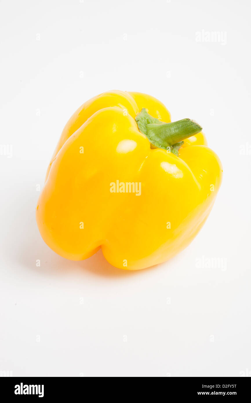 Close-up of yellow bell pepper over white background Stock Photo