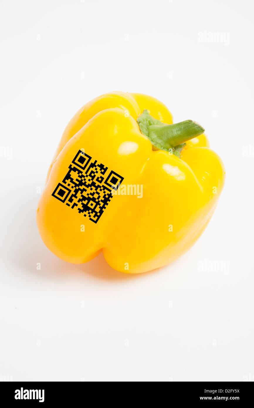 Close-up of yellow bell pepper with bar code over white background Stock Photo